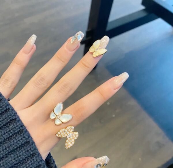 Van Cleef & Arpelf. Two Butterfly Between the Finger ring