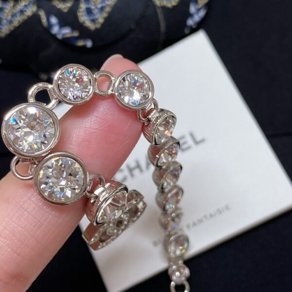 CHANEL. Crystal Long Tassel Earrings