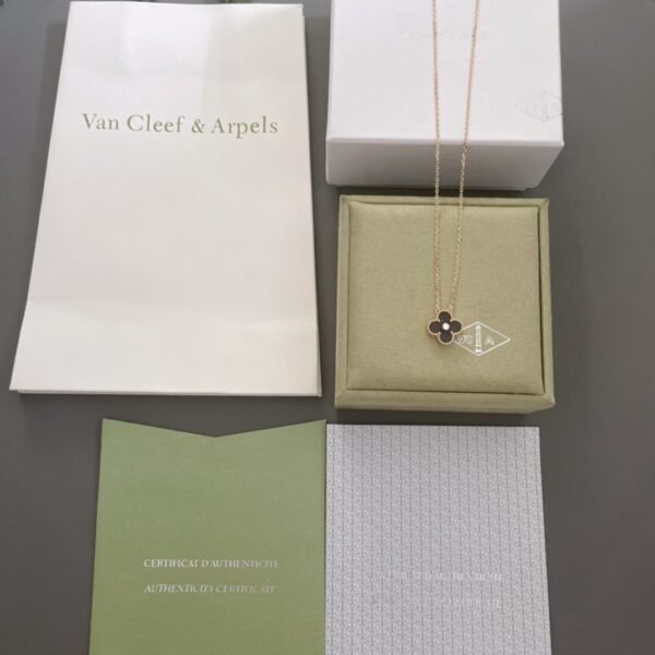 Van Cleef & Arpels. Vintage Alhambra Diamond Two Tone Holiday Pendant 2023