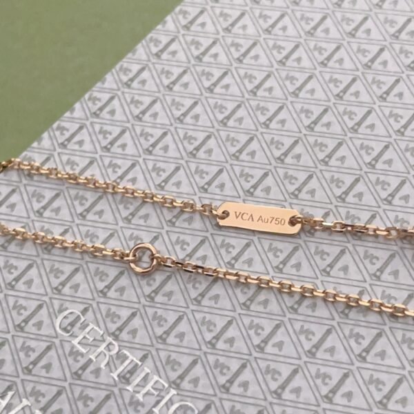 Van Cleef & Arpels. Vintage Alhambra Diamond Two Tone Holiday Pendant 2023