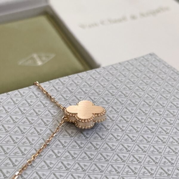 Van Cleef & Arpels. Vintage Alhambra Diamond Two Tone Holiday Pendant 2023