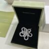 Van Cleef & Arpels. Flowerlace clip and pendant