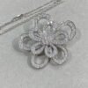 Van Cleef & Arpels. Flowerlace clip and pendant