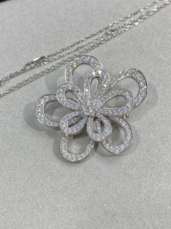 Van Cleef & Arpels. Flowerlace clip and pendant