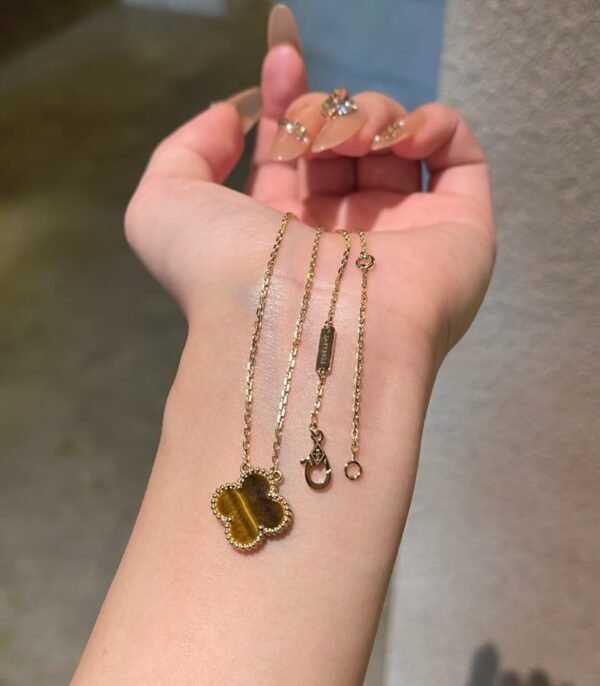 Van Cleef & Arpels. Vintage Alhambra pendant (Tiger Eye)