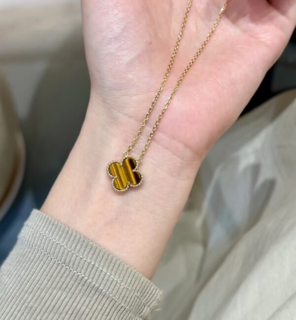 Van Cleef & Arpels. Vintage Alhambra pendant (Tiger Eye)