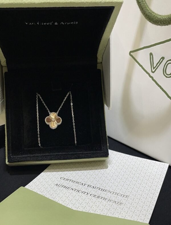 Van Cleef & Arpels. Vintage Alhambra Diamond Two Tone Holiday Pendant 2024