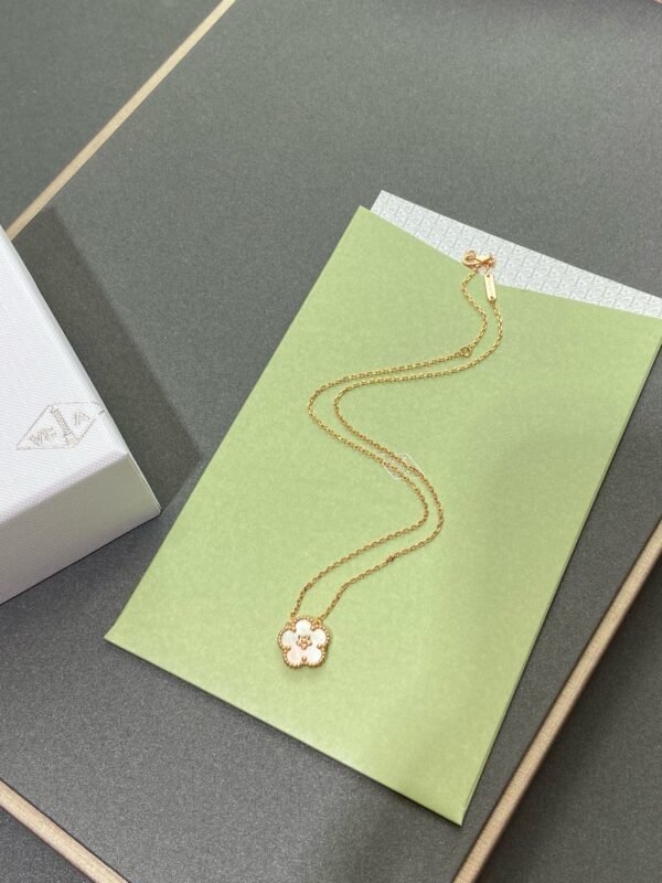 Van Cleef & Arpels. Lucky Spring pendant, plum blossom