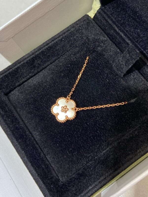 Van Cleef & Arpels. Lucky Spring pendant, plum blossom