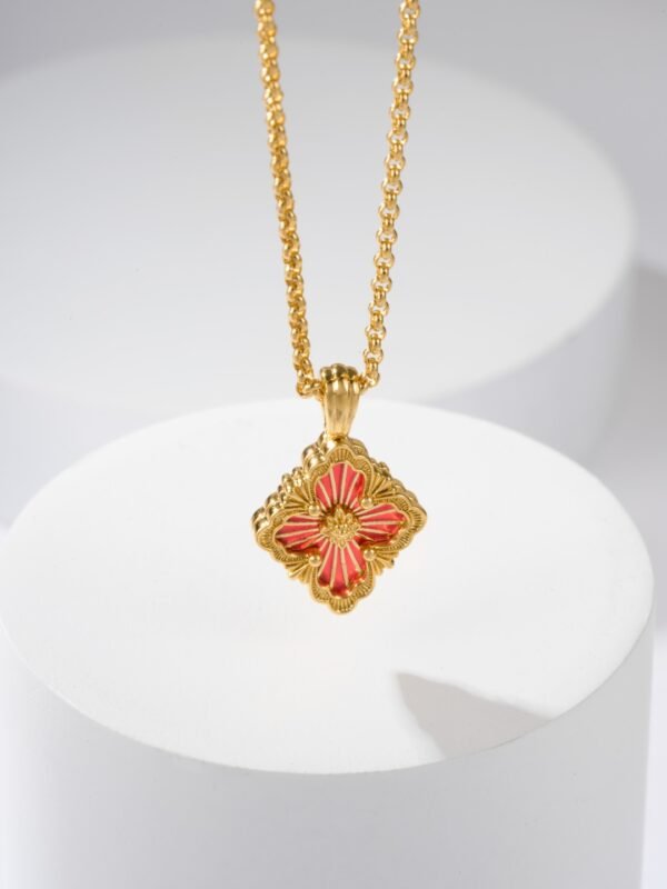 BUCCELLATI. OPERA TULLE PENDANT IN YELLOW GOLD WITH RED ENAMEL