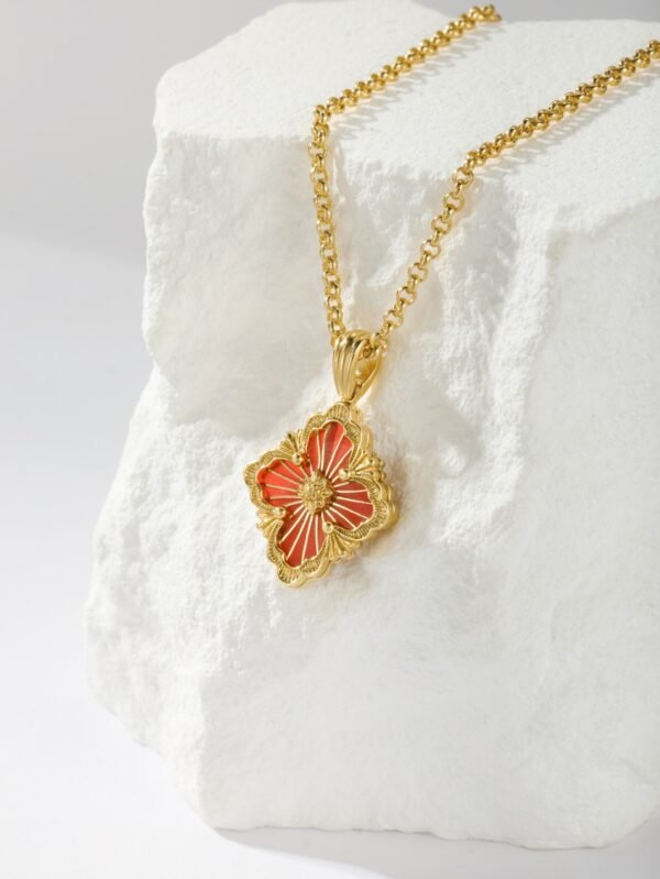 BUCCELLATI. OPERA TULLE PENDANT IN YELLOW GOLD WITH RED ENAMEL