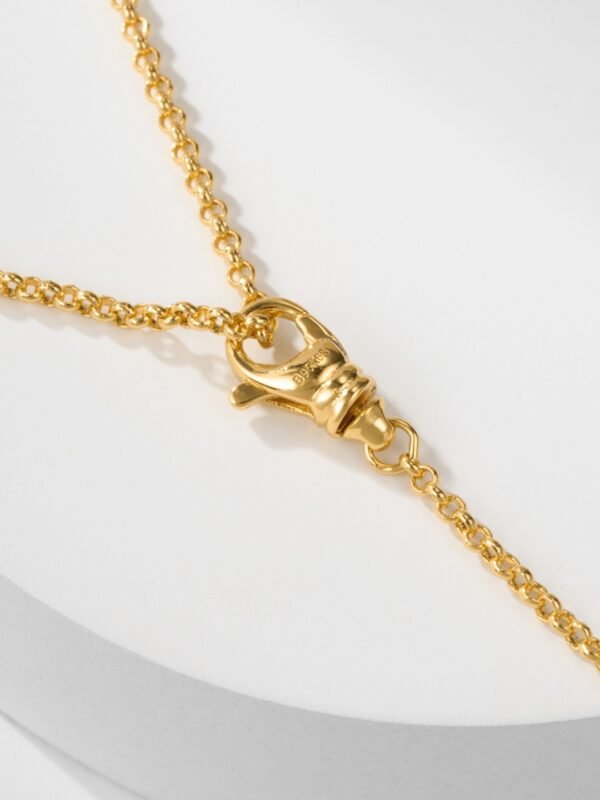 BUCCELLATI. OPERA TULLE PENDANT IN YELLOW GOLD WITH RED ENAMEL